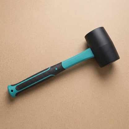 Close up of the rubber mallet's durable fiberglass handle and non-slip grip.