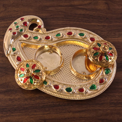 Golden Tika box being used in a traditional ritual
